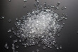 © Nastia - White granules of rubber, polypropylene or polyamide on a black background