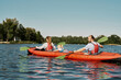 © Svitlana - European family floats on kayak in lake or river
