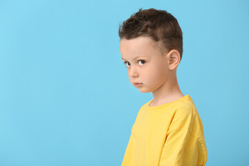 Poster - Portrait of cute little boy on color background