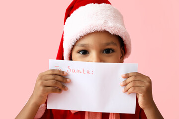 Sticker - Cute African-American boy with letter to Santa on color background