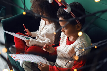 Sticker - Cute African-American children writing letters to Santa at home