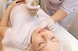 © Roman - The cosmetologist performs the chin lift procedure by injecting beauty injections