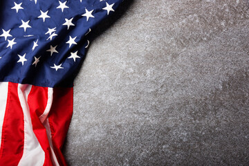 Top view overhead America United States flag, memorial remembrance and thank you of hero, studio shot with copy space concrete board background, USA holiday Veterans or Independence day concept