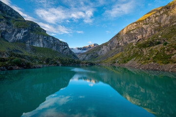 Mountain lake in Pyrenees Lac des Gloriettes during sunrise - France