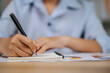 © Johnstocker - Young woman working with paperwork at home