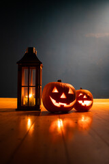 spooky Jack O' Lanterns on wooden table Glowing In Fantasy Night. Halloween Background