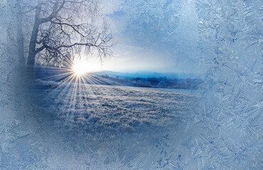 Wall Mural - frozen window and winter morning with sunrise