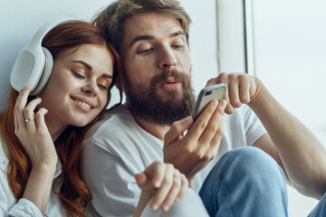 Wall Mural - family sitting on the windowsill romance joy technology