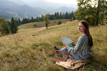 Poster - Young woman drawing landscape with soft pastels in nature. Space for text