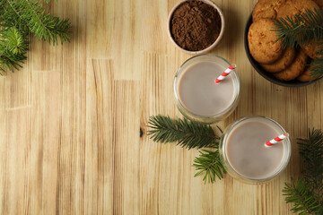 Concept of tasty drink with cocoa on wooden background