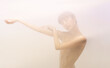 © master1305 - Silhouette of young girl posing in stage smoke. Looking away. Beauty, emotions, concept.