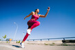 © ADDICTIVE STOCK - Active woman running on asphalt