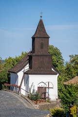 Wall Mural - Old church of St. Martin on the street in ethnic village Holloko, Hungary