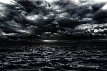 Wall Mural - dark stormy sea with a dramatic cloudy sky