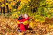 © Татьяна Михайлина - Happy children little girls cuddle in yellow maple leaves in autumn park outdoor