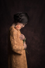 Asian Girl In Yellow Dress With Dahlia Flower In Painterly Rembrandt Studio Style