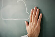 © amanaimages - 黒板に書かれた雲に手を添える