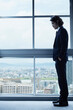 © amanaimages - 窓辺に佇む一人の男性