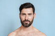 © Stock 4 You - Closeup portrait of smiling half naked man looking at camera isolated over blue