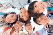 © amanaimages - ランドセルを背負って輪になる笑顔の小学生6人