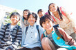 © amanaimages - 校庭に集まっている笑顔の小学生6人