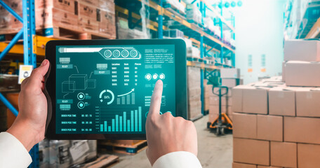 Warehouse management innovative software in computer for real time monitoring of goods package delivery . Computer screen showing smart inventory dashboard for storage and supply chain distribution .