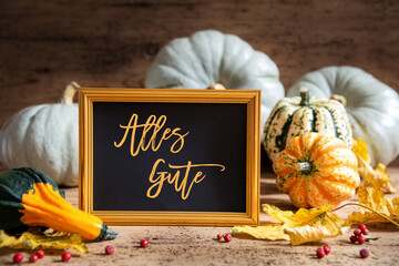 Wall Mural - autumn pumpkin decoration, text alles gute means best wishes, golden frame