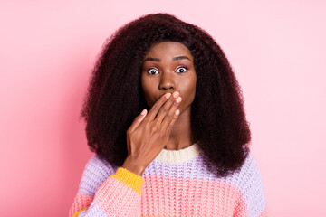 Sticker - Portrait of puzzled dark skin girl arm palm covering mouth lips staring camera isolated on pink color background