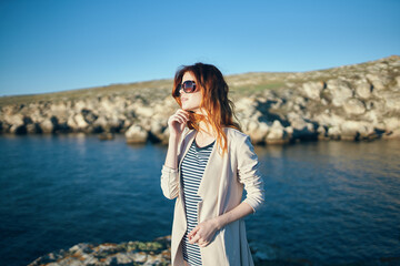 Poster - woman in sunglasses outdoors summer landscape sea fresh air