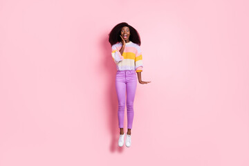 Poster - Full body photo of impressed dark skin girl jump hand on cheek open mouth isolated on pink color background