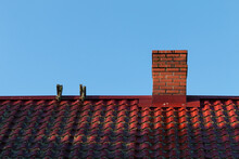 Red House Roof With Red Brick Chimney