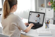 © Syda Productions - education, school and distant learning concept - student woman with teacher on laptop computer having online class at home