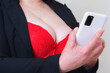 © ARVD73 - Busty big breasts secretary in red bra online flirt on the phone, desire.Sexy Flirt concept.