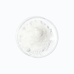 closeup chemical ingredient on white laboratory table. di-ammonium prosphate in chemical watch glass