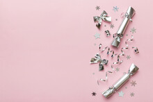 Christmas Crackers With Shiny Confetti On Color Background, Top View, Copy Space