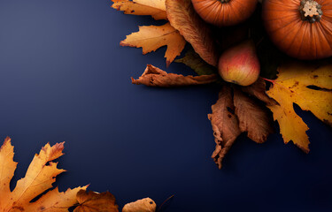 Sticker - a thanksgiving autumn harvest background of pumpkins, pears, leaves on a blue table with copy space.