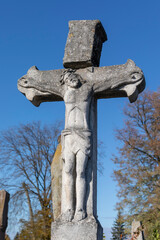 Wall Mural - Christian cross with the crucifixion of Jesus Christ on the grave in the cemetery