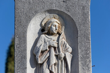 Wall Mural - Sculpture or monument to the Mother of God in the cemetery