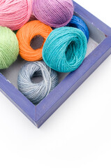 Poster - blue wooden box with multicolored  decoration yarn with text space