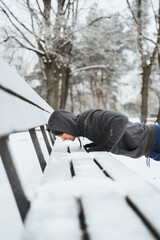 Wall Mural - Athletic man doing push-ups during his calisthenics winter workout