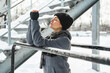 Young athletic woman during her winter workout outside