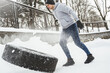 Strong sportsman during his cross training workout during snowy and cold winter day.