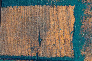 The background is wooden grunge style. Dirty surface of a wooden board