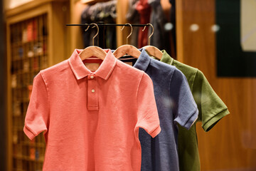 Hanged for presentation multiple colorful polos for sale at the fashionable store