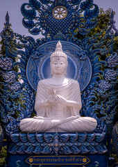 Wall Mural - Chiang Rai, Thailand - Sep 05, 2020 : Beautiful Sculpture of white Buddha image at Wat Rong Suea Ten Temple, also known as the Blue Temple, locate at Chiang Rai province, northern part of Thailand. Se