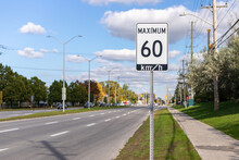 Speed Limit Road Sign In The Street, 60 Km Per Hour Maximum In Ottawa City, Canada. City Traffic On The Road.