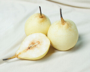 Wall Mural - Fresh pears to open your breakfast menu. Pears have a sweet and fresh taste and are also rich in fiber. Pears have benefits for improving gut health and are rich in antioxidants. Focus blur.