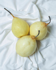 Wall Mural - Fresh pears to open your breakfast menu. Pears have a sweet and fresh taste and are also rich in fiber. Pears have benefits for improving gut health and are rich in antioxidants. Focus blur.