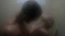 Silhouette Of Lovers In Shower, View Through Wet Glass, Kiss And Embrace Of Naked People