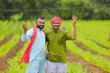 © Niks Ads - Young indian farmers at green turmeric agriculture field.